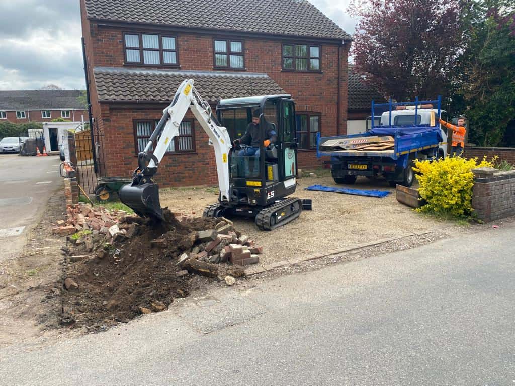 This is a photo of an operative of Halesworth Driveway Contractors Digging out for a new tarmac driveway